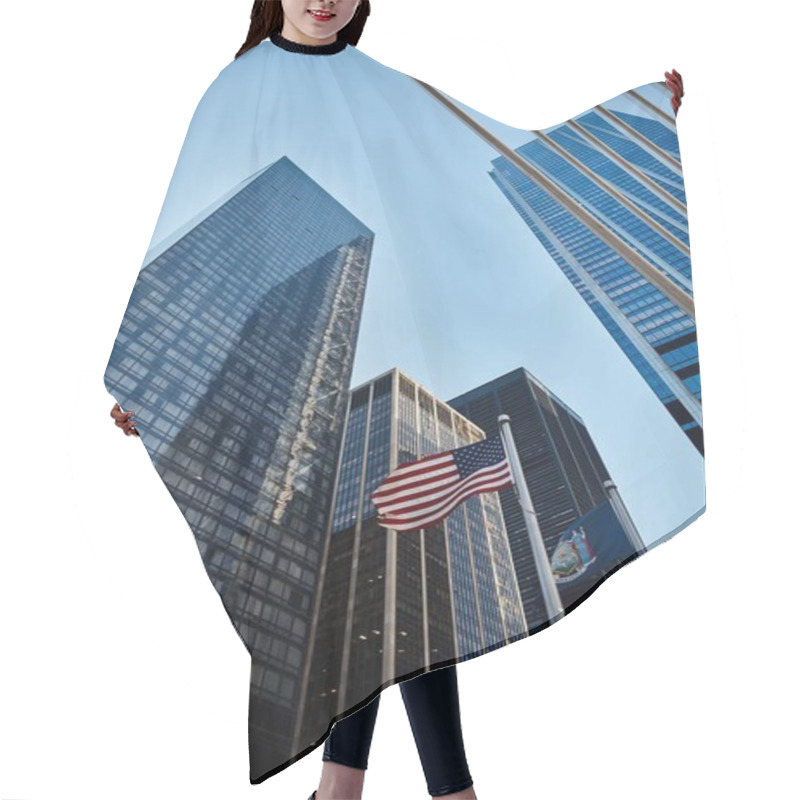 Personality  A Low Angle Shot Of Skyscrapers In New York City With The American Flag Waving In The Breeze. Hair Cutting Cape