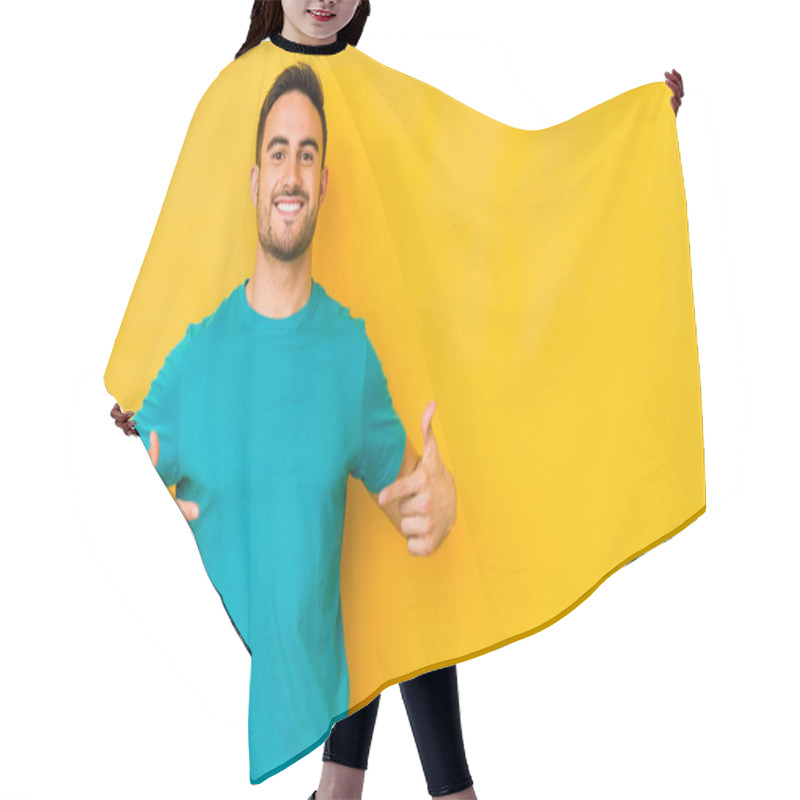 Personality  Young Caucasian Man Isolated On Yellow Bakground Points Down With Fingers, Positive Feeling. Hair Cutting Cape