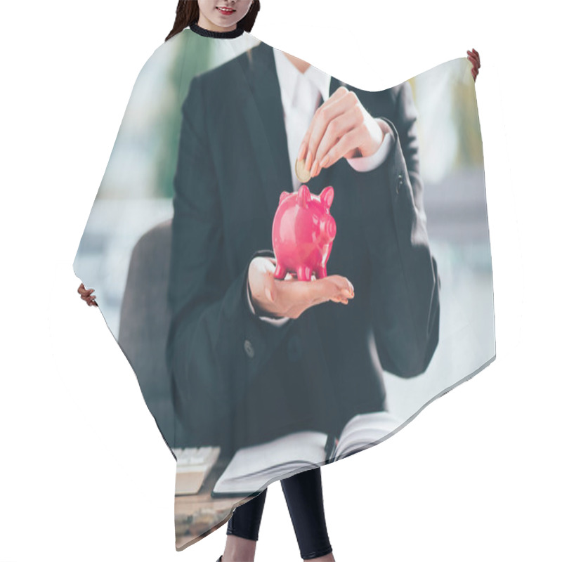 Personality  Cropped Shot Of Businesswoman Putting Coin Into Pink Piggy Bank  Hair Cutting Cape