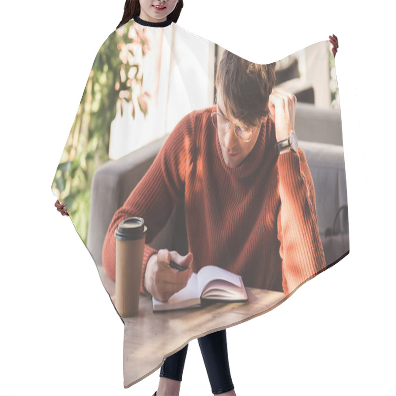 Personality  Handsome Man In Glasses Looking At Notebook Near Disposable Cup In Cafe Hair Cutting Cape