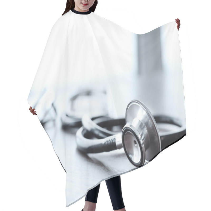 Personality  Stethoscope With Digital Tablet Computer On Wooden Table And  Ba Hair Cutting Cape