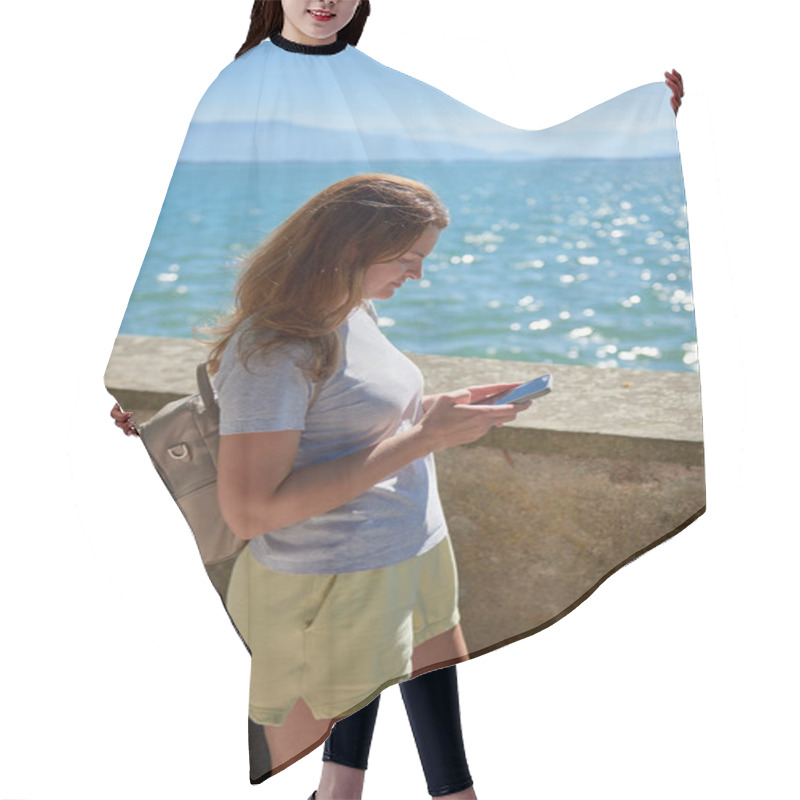 Personality  Woman Capturing Scenic Photos By A Sparkling Lake On A Sunny Day With Majestic Mountain Views. Idyllic Lakeside Setting Showcases Natural Beauty And Outdoor Adventure In A Serene European Landscape Hair Cutting Cape