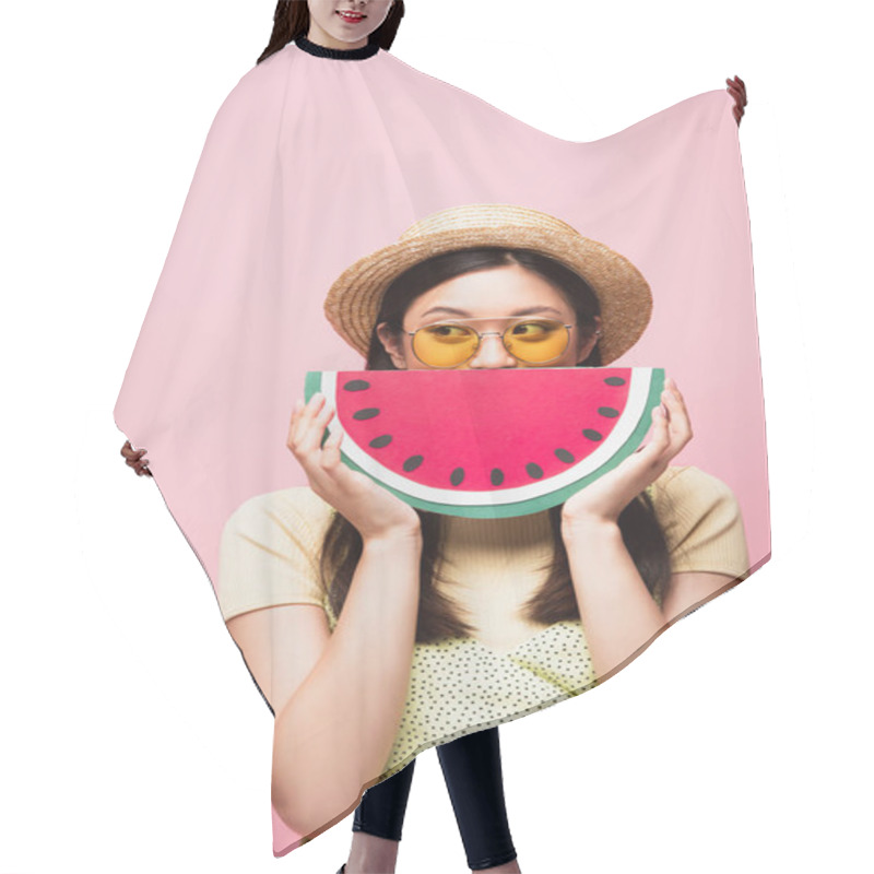 Personality  Asian Woman In Sunglasses And Straw Hat Covering Face With Paper Watermelon And Looking Away Isolated On Pink  Hair Cutting Cape