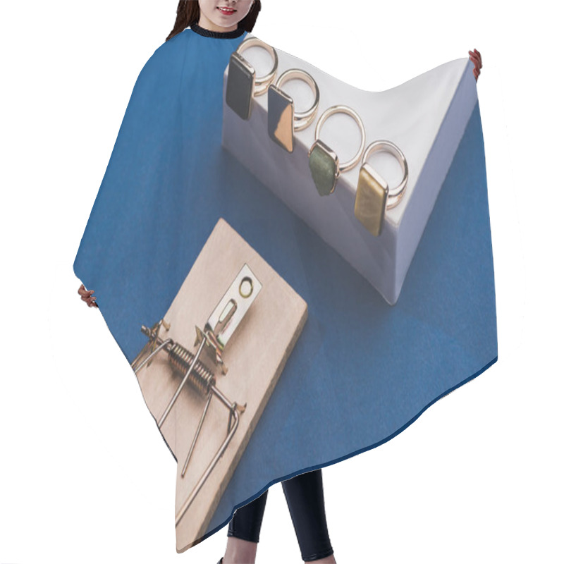 Personality  High Angle View Of Jewellery Rings On White Cube With Mouse Trap On Blue Background Hair Cutting Cape