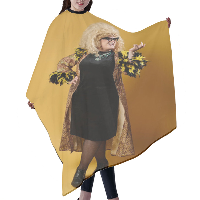 Personality  Queer Person In Stylish Outfit With Feathered Accents Posing Confidently Against Yellow Hair Cutting Cape