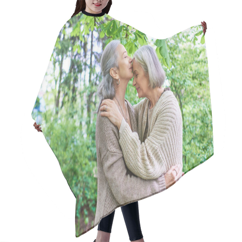 Personality  A Lesbian Couple In Cardigans Embrace Each Other Tenderly Under The Shade Of A Leafy Tree, Their Love Palpable In Their Embrace. Hair Cutting Cape