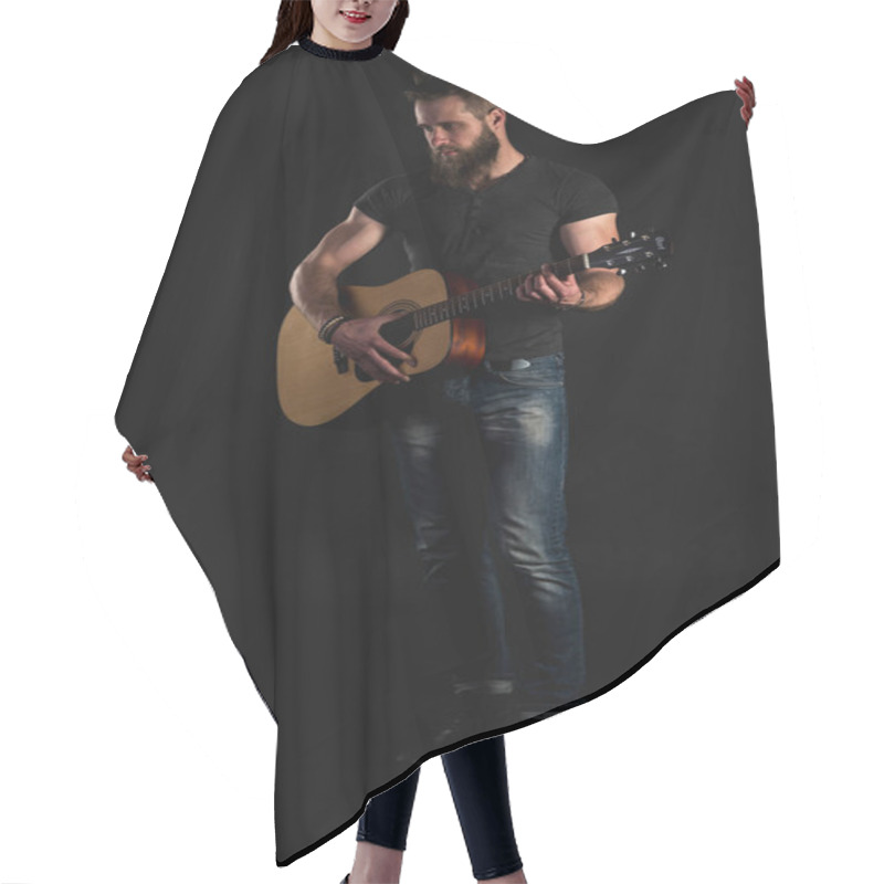 Personality  A Charismatic And Stylish Man With A Beard Stands Full-length And Plays An Acoustic Guitar, On A Black Isolated Background. Vertical Frame Hair Cutting Cape