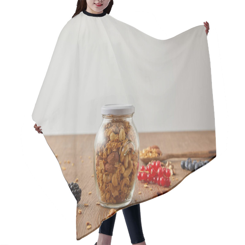 Personality  Selective Focus Of Jar Of Granola With Nuts, Oat Flakes, Berries And Cereal Bars On Wooden Background Isolated On Grey Hair Cutting Cape