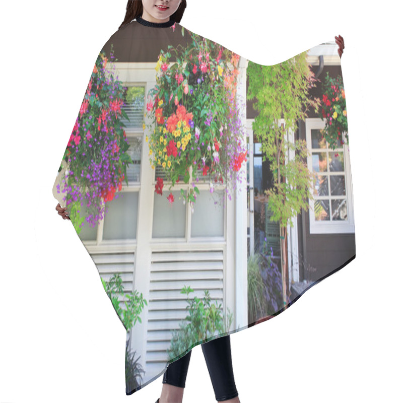 Personality  Flowers In The Hanging Baskets With White Windows And Brown Wall. Hair Cutting Cape