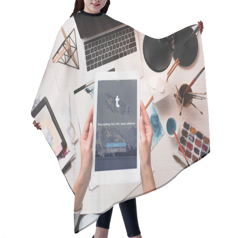 Personality  Cropped View Of Designer Holding Tablet With Tumblr App On Screen At Office Desk With Art Supplies, Flat Lay Hair Cutting Cape