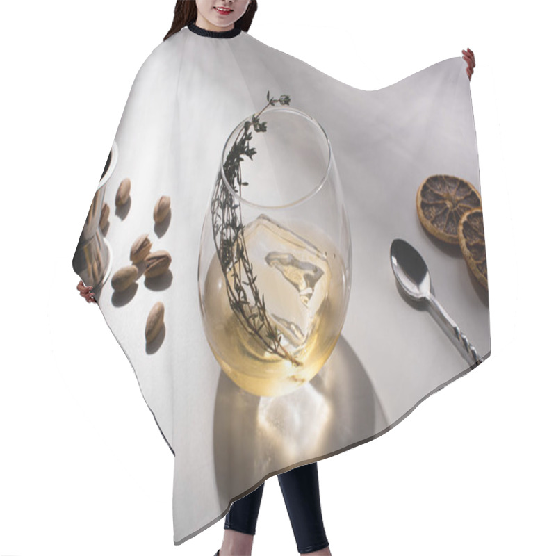 Personality  Transparent Glass With Herb, Ice Cube And Whiskey On White Table With Shadow Near Pistachios, Spoon, Dried Citrus Slices, Jigger Hair Cutting Cape