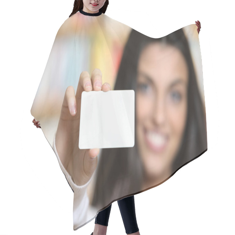 Personality  Smiling Young Female Showing A Business Card - Copy Space. Hair Cutting Cape