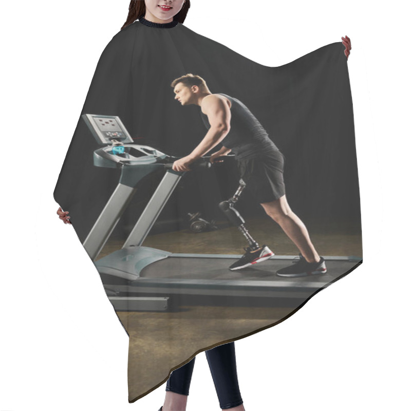 Personality  A Man With A Prosthetic Leg Runs On A Treadmill In A Dimly Lit Room, Showing Determination And Strength In His Workout. Hair Cutting Cape