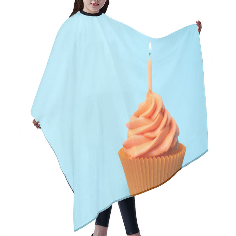 Personality  Delicious Birthday Cupcake With Orange Cream And Burning Candle On Light Blue Background. Space For Text Hair Cutting Cape