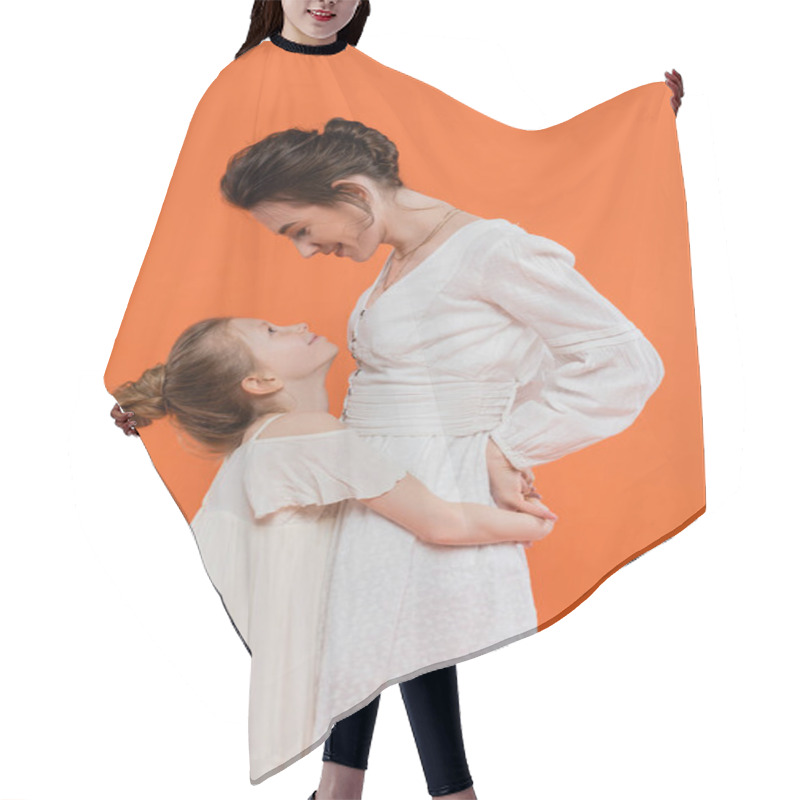 Personality  Summer Trends, Preteen Girl Hugging Young Mother On Orange Background, White Sun Dresses, Togetherness, Fashion And Style Concept, Bonding And Love, Modern Parenting, Happiness  Hair Cutting Cape