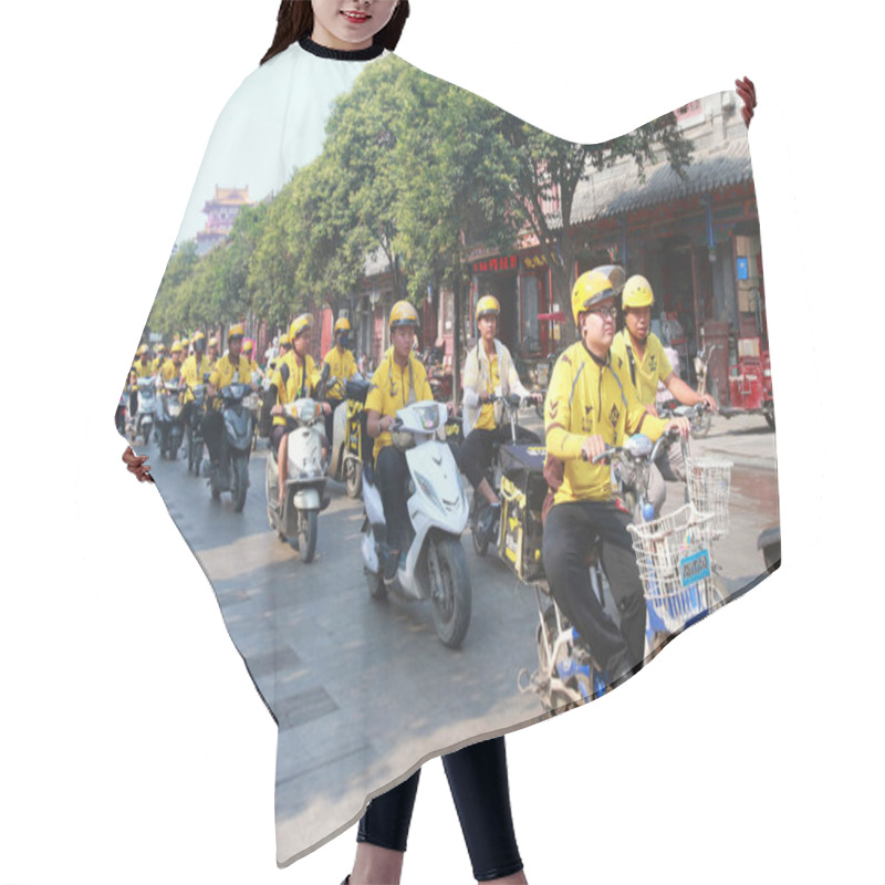 Personality  A Group Of Food Delivery Couriers Of Chinese Online Food Delivery Company Meituan Waimai Ride Electric Bikes To Deliver Meals On A Road In Kaifeng City, Central China's Henan Province, 27 June 2017 Hair Cutting Cape