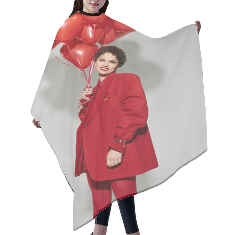 Personality  A Young Beautiful Woman Radiates Joy While Holding Heart Shaped Balloons, Dressed In Striking Red. Hair Cutting Cape