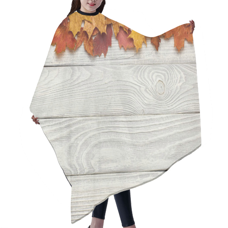 Personality  Wooden Background With Autumn Leaves  Hair Cutting Cape