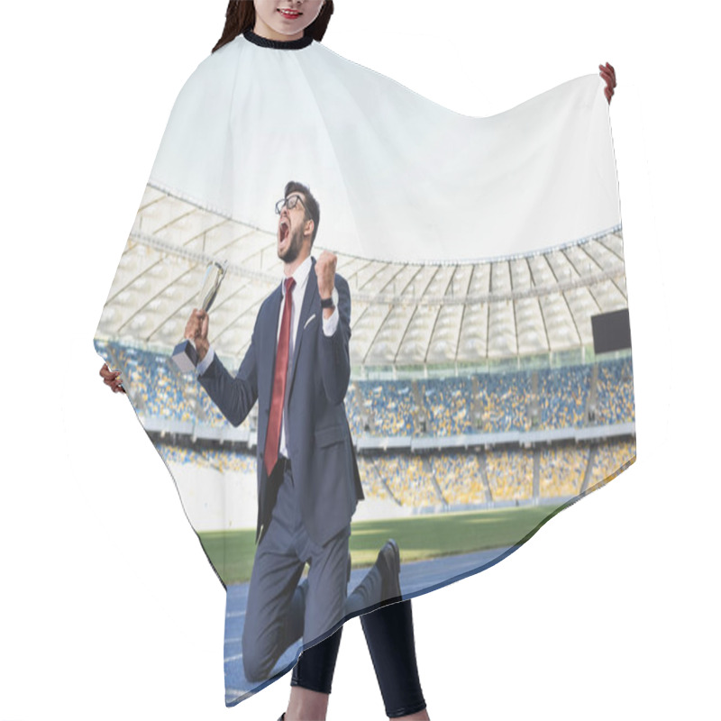 Personality  Young Businessman In Suit Standing On Knees On Running Track With Trophy And Scream At Stadium Hair Cutting Cape