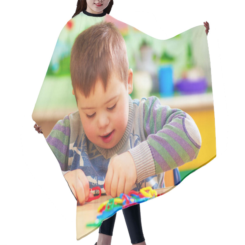 Personality  Cute Kid With Down's Syndrome Playing In Kindergarten Hair Cutting Cape