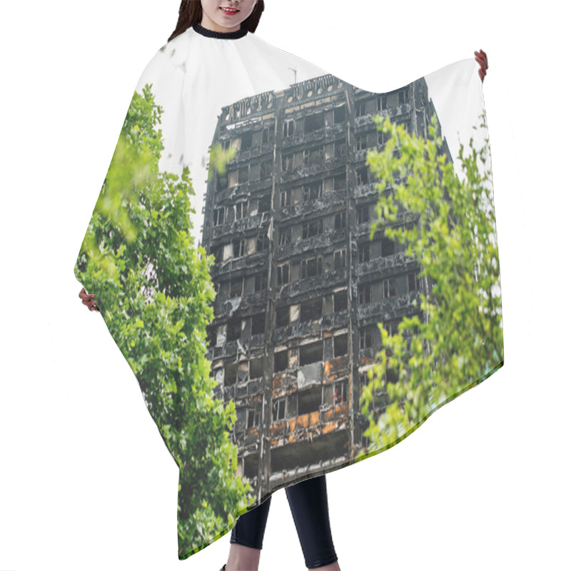 Personality  London, UK. 28th June 2017. EDITORIAL - The Grenfell Tower Fire - The Burnt Remains And Devastation Of The Fierce Fire, Which Ripped Through The Tower Block Leaving Hundreds Homeless And Many Dead. Hair Cutting Cape