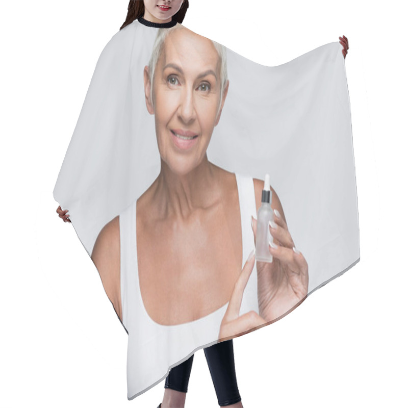 Personality  Happy Senior Woman Holding Bottle With Vitamin C Serum Isolated On Grey Hair Cutting Cape