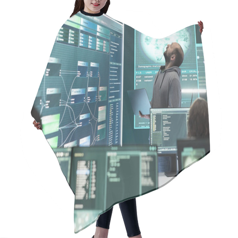 Personality  Hacker Specialist Working On Governmental Cyber Surveillance In Agency Center, Examining Stolen Information On A Big Screen During Hybrid War. IT Expert Works On Intelligence Espionage. Hair Cutting Cape