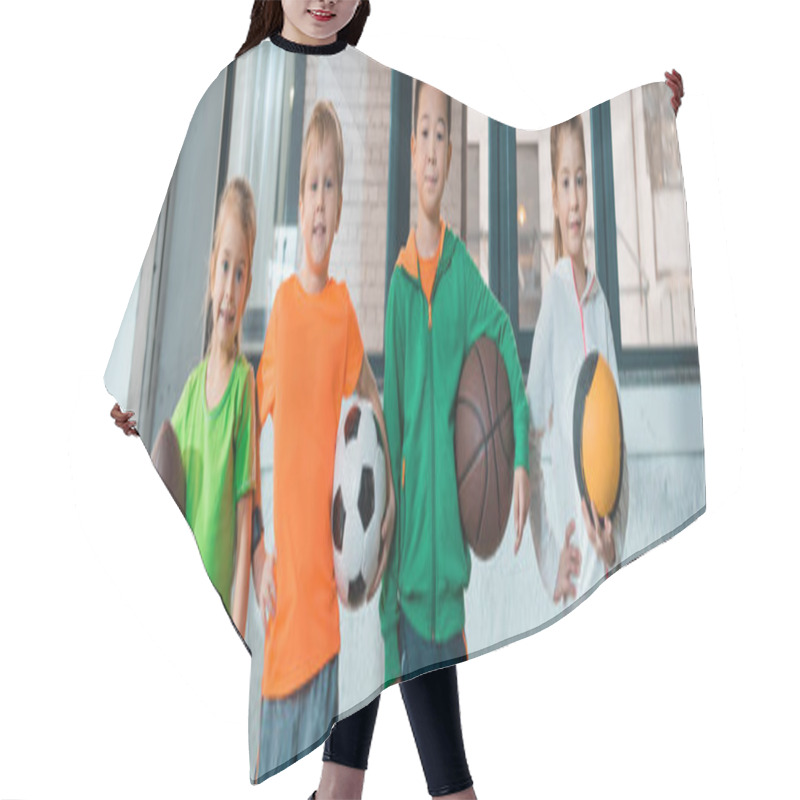 Personality  Front View Of Multicultural Children Holding Balls And Smiling Together In Gym, Panoramic Shot Hair Cutting Cape