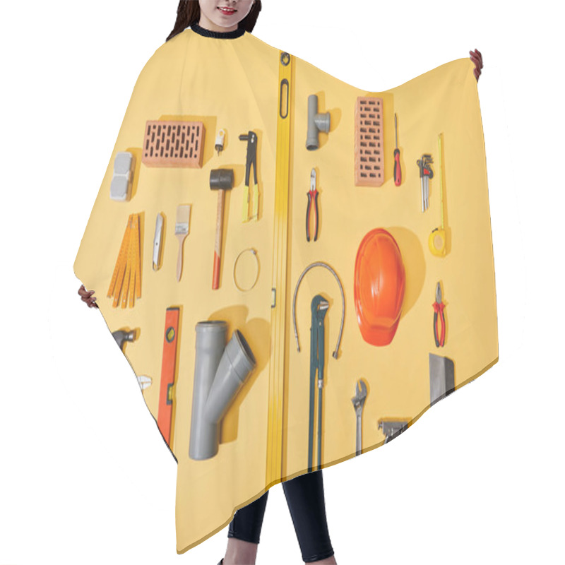 Personality  Top View Of Bricks, Industrial Tools, Helmet, Plumbing Hose, And Measuring Tape On Yellow Background Hair Cutting Cape