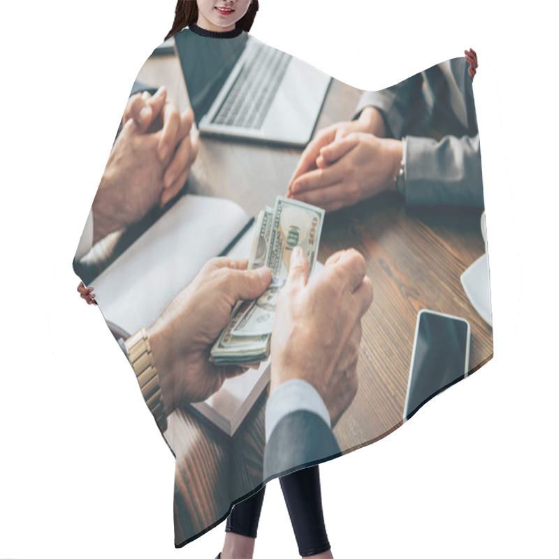 Personality  Cropped View Of Businessman Holding Money Near Smartphone, Coffee And Colleagues On Blurred Background  Hair Cutting Cape