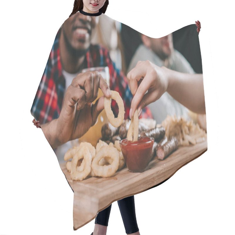 Personality  Cropped View Of Multicultural Friends Eating Fried Onion Rings With Ketchup In Pub Hair Cutting Cape