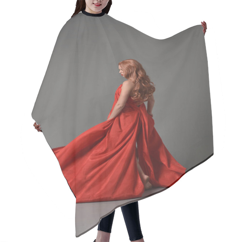 Personality  Full Length Portrait Of Woman Wearing A Red Silk Dress, Standing Pose On Grey Studio Background. Hair Cutting Cape