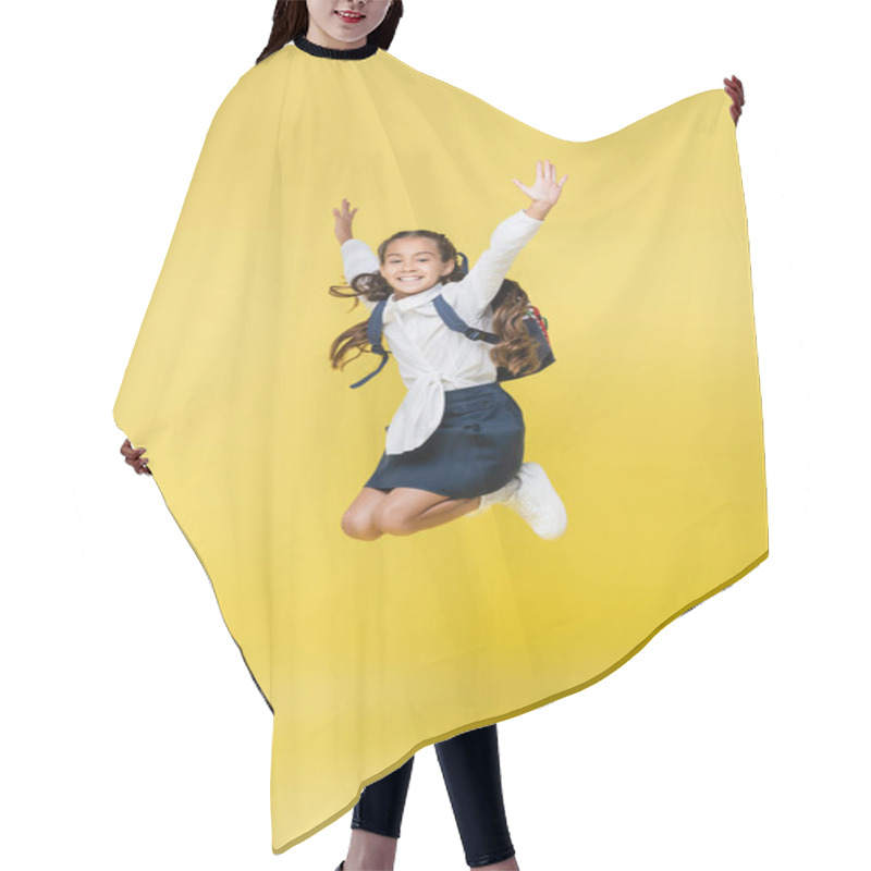 Personality  Positive Schoolkid Jumping And Looking At Camera On Yellow Hair Cutting Cape