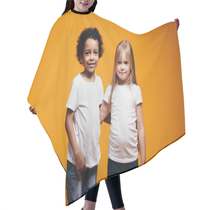 Personality  A Dark-skinned Boy And A Blonde Girl In White T-shirts Hugging As A Sign Of Interracial Friendship Since Childhood On An Orange Background Hair Cutting Cape