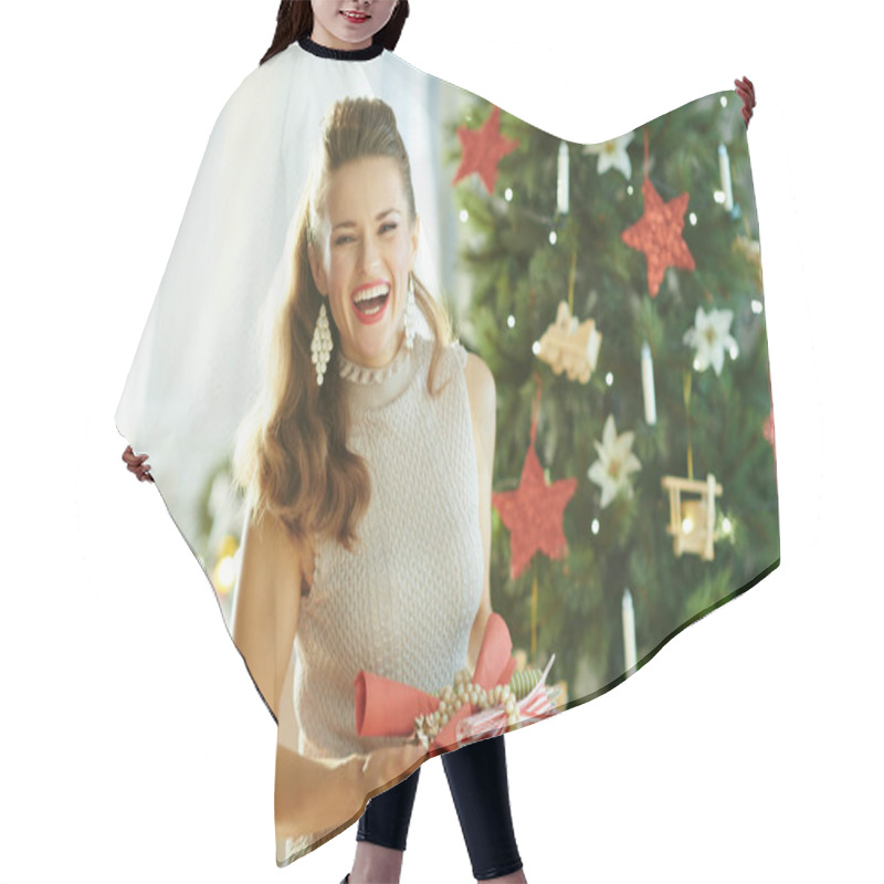 Personality  Portrait Of Young Woman With Serving Plates Laughing With Opened Mouth Near Christmas Tree Hair Cutting Cape