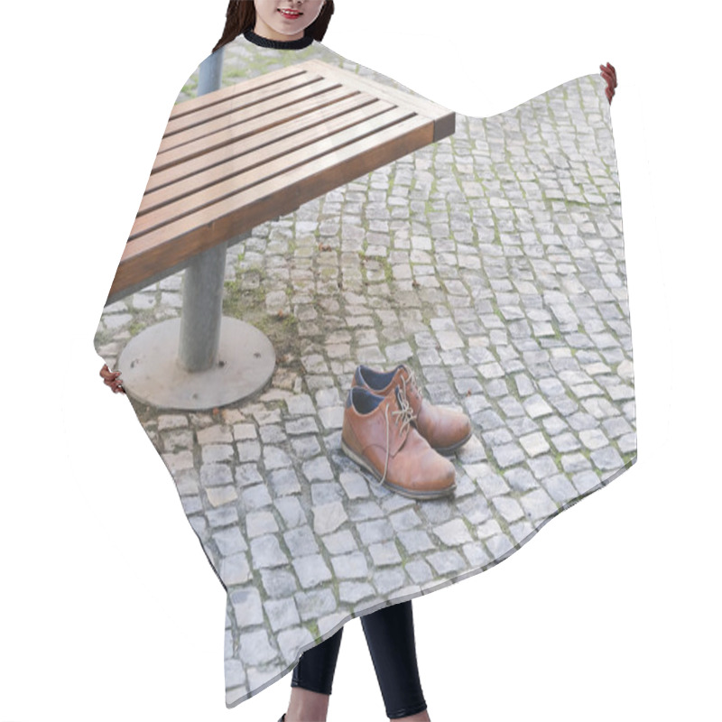 Personality  Brown Leather Shoes On A Cobblestone Pavement Next To A Bench In An Urban Setting. Hair Cutting Cape