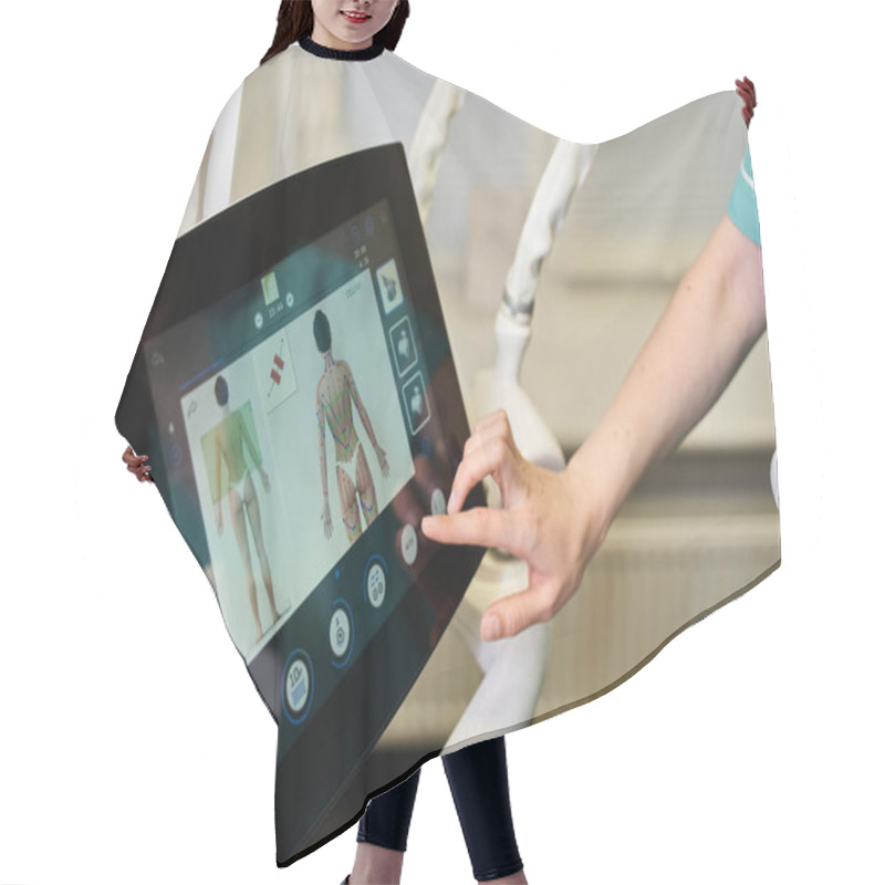 Personality  A Young Medical Professional Uses A Touchscreen To Review Dermatology Procedures. Hair Cutting Cape