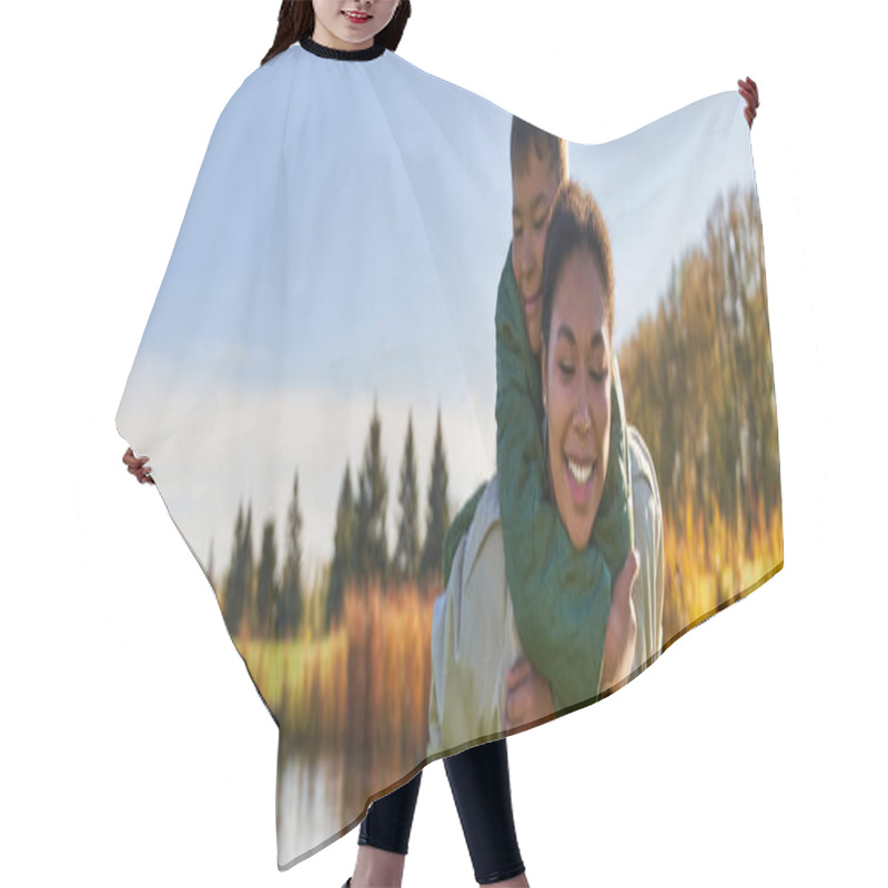 Personality  Happy Mother Piggybacking Son Near Pond With Ducks, Childhood, African American, Autumn, Banner Hair Cutting Cape