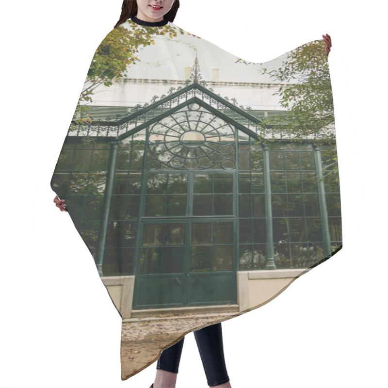 Personality  The Historic Greenhouse At Jardim Botnico Da Ajuda In Lisbon, Portugal, Showcases Stunning Iron And Glass Architecture Surrounded By Lush Greenery, Offering A Peaceful And Scenic Atmosphere. Hair Cutting Cape