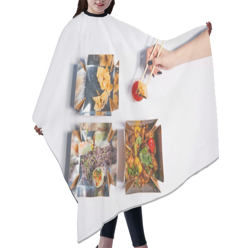 Personality  Top View Of Woman Holding Chopsticks With Dumpling Near Sauce And Takeaway Boxes With Prepared Chinese Food On White  Hair Cutting Cape