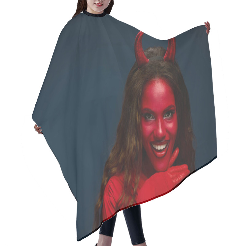 Personality  A Striking Woman Dressed As A Devil Showcases Her Playful Spirit With A Beaming Smile. Hair Cutting Cape