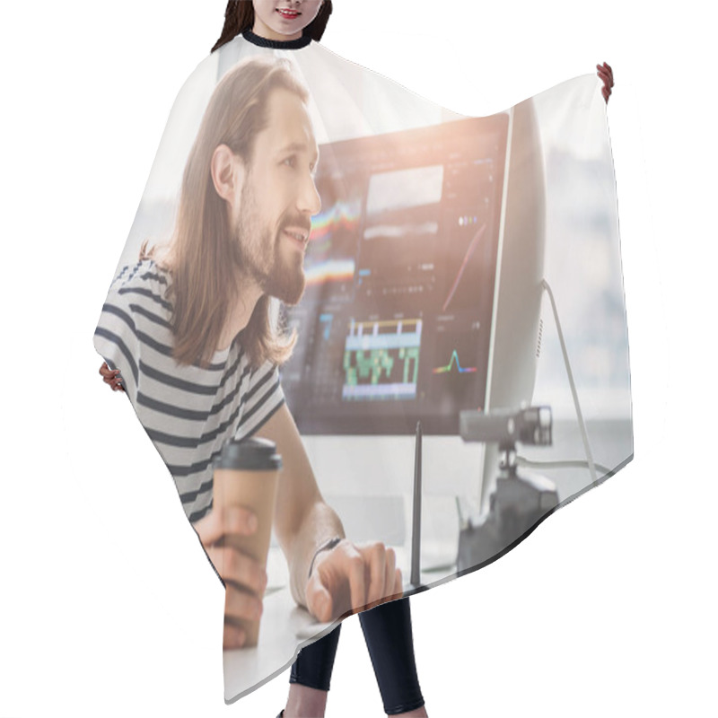 Personality  Selective Focus Of Bearded Editor Holding Paper Cup And Looking At Computer Monitor  Hair Cutting Cape