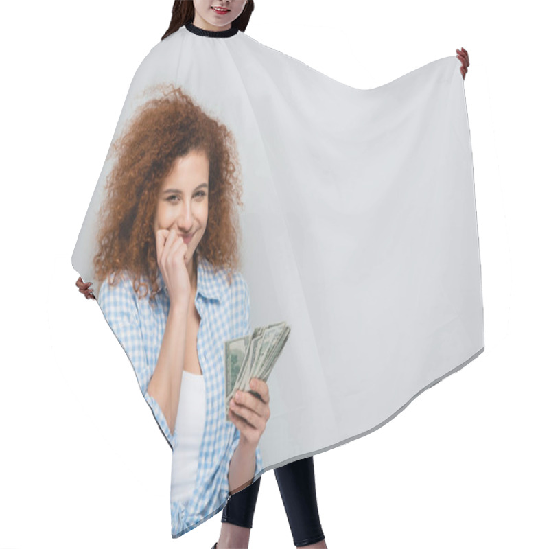 Personality  Joyful Woman With Hand Near Face Holding Dollars On Grey Background Hair Cutting Cape