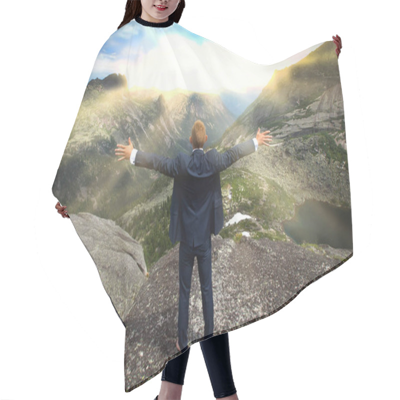 Personality  Portrait Of A Young Man In A Business Suit At The Top Of The Mountain On The Background Of Mountains And Blue Sky On A Sunny Summer Day Hair Cutting Cape