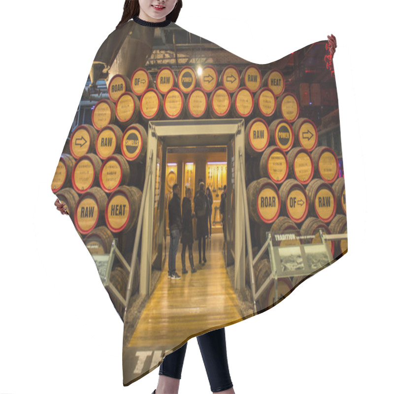 Personality  DUBLIN, IRELAND - FEBRUARY 7, 2017: People Visiting The Interior Of The Guinness Storehouse. Wooden Barrels Of Beer Hair Cutting Cape