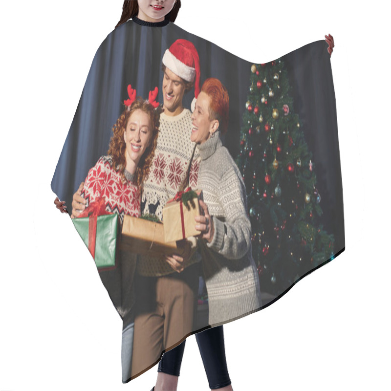 Personality  A Group Of Young Coworkers Shares Laughter And Presents In A Cozy Office Decorated For Christmas. Hair Cutting Cape