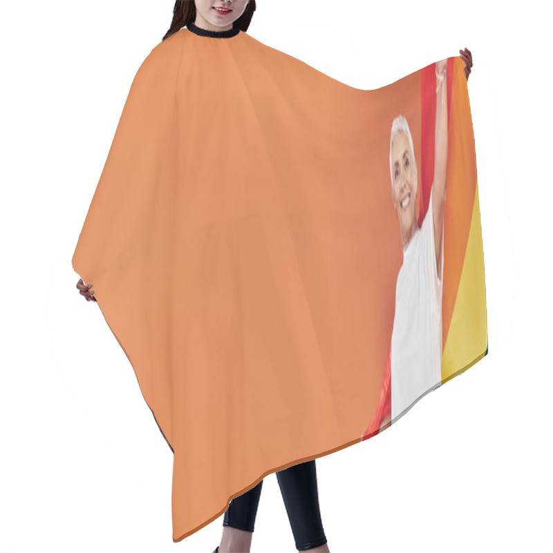 Personality  Mature Woman Proudly Waves A Rainbow Flag, Radiating Happiness And Confidence. Hair Cutting Cape