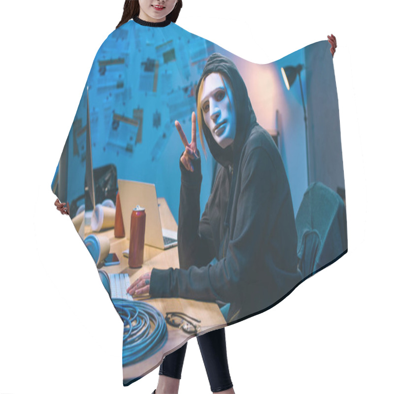 Personality  Female Hacker In Mask Showing V Sign At Workplace Hair Cutting Cape