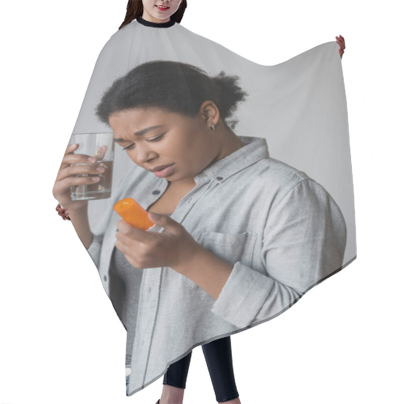 Personality  Upset Multiracial Woman Holding Pills And Glass Of Water At Home  Hair Cutting Cape