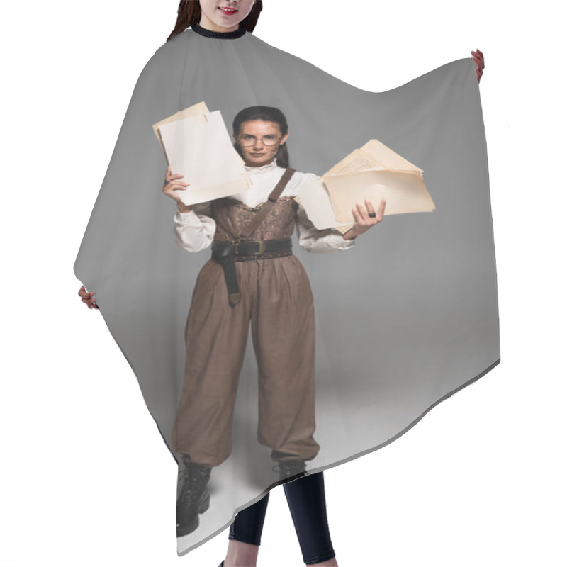 Personality  Full Length View Of Steampunk Woman In Glasses Holding Documents On Grey Hair Cutting Cape